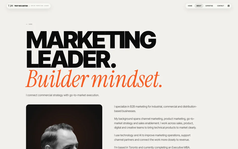 The current troymccartan.com about section, with a monochrome portrait of Troy beside the headline Marketing leader, Builder mindset.